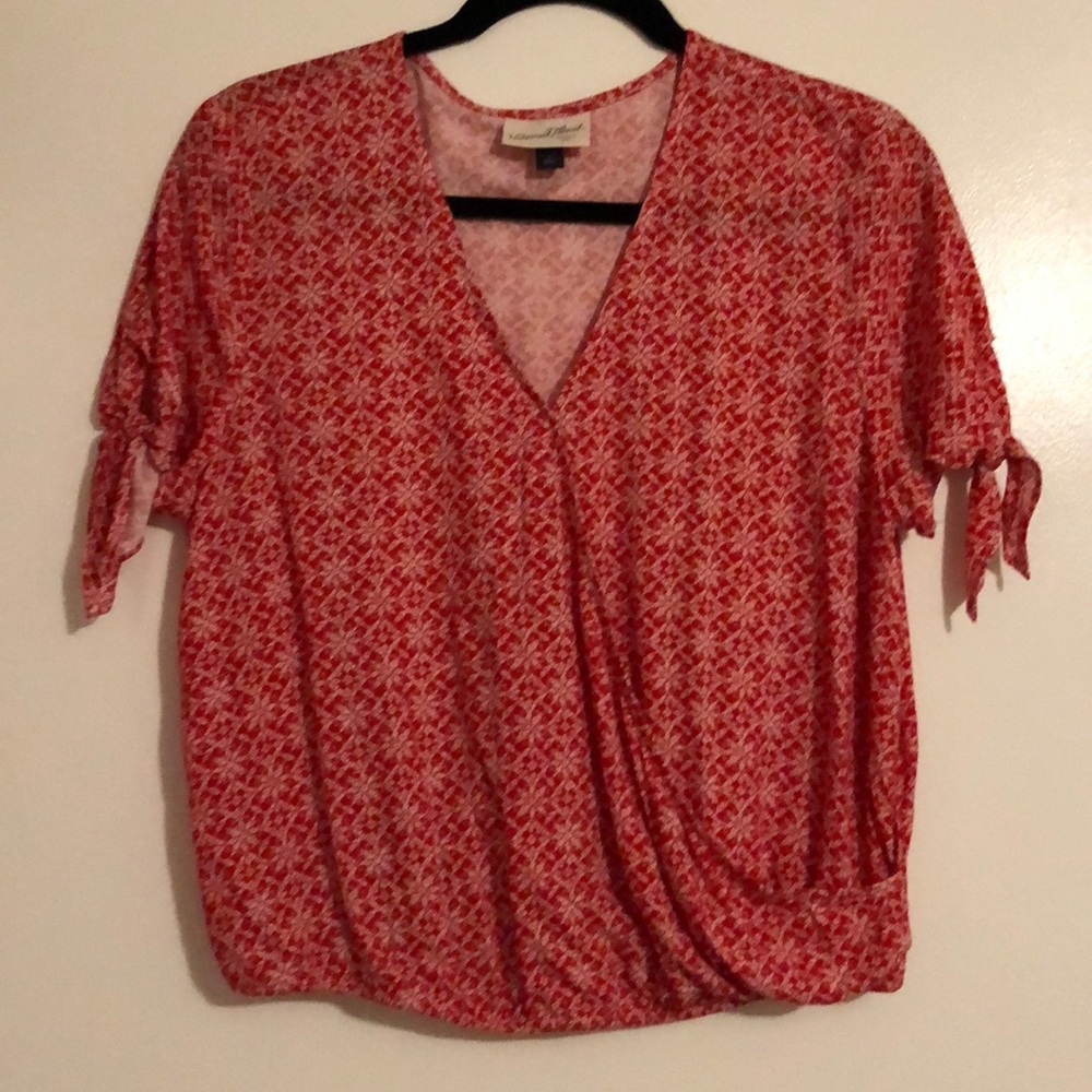 Red floral wrap-front blouse